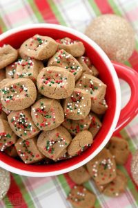 A bowl of Gingerbread Cookie Bites topped with festive sprinkles.