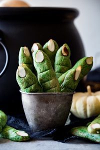 A bowl of Witch Finger Cookies with sliced almonds as the "nails".