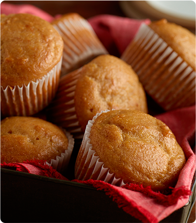 A basket full of Apple Spice Banana Muffins.
