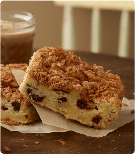 Two Cherry Coconut Bars resting on napkins.