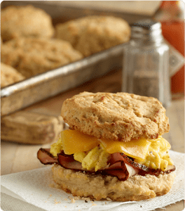 Ham, egg and cheese nestled between two Glorious Gluten Free Biscuits.