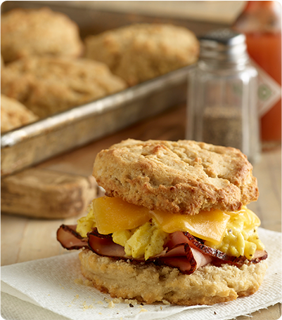 Ham, egg and cheese nestled between two Glorious Gluten Free Biscuits.