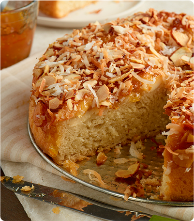 A Hawaiian Coffee Cake with a slice cut out.