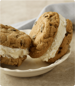 Two Mini Cookie Ice Cream Sandwiches in a bowl.