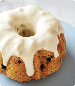 A Morning Yogurt Cake topped with a creamy glaze.