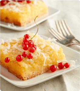 A Piña Colada Bar topped with coconut flakes and garnishing.