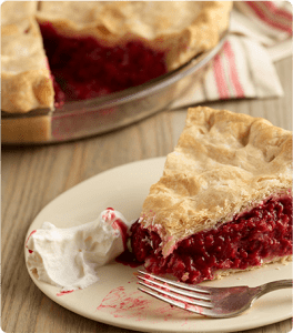 A slice of Raspberry Pie with a bite taken out of it.