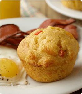 A Spicy Garden Cornbread Muffin paired with eggs and bacon.