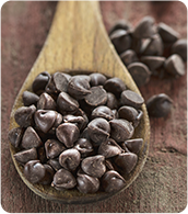 chocolate chips in a wooden spoon