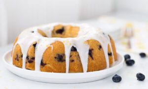 A Blueberry Lemon Pound Cake topped with a creamy lemon glaze.