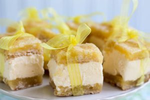 Several Lemon Ice Cream Sandwich Bars with yellow ribbon tied in a bow around each bar.