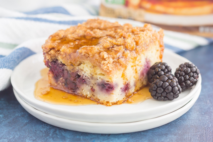 A slice of Blackberry Streusel Pancake Bake garnished with blackberries.