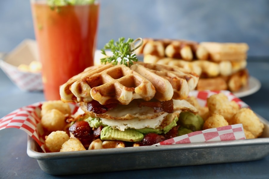Waffle Breakfast Sandwich served with tater tots.