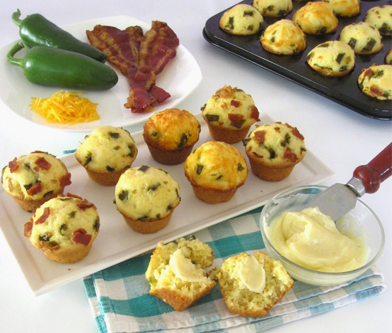 Several Gluten Free Jalapeño Cornbread Muffins on a white platter.