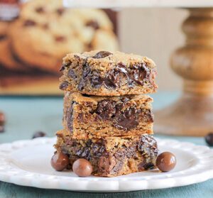 A stack of Espresso Blondies on a white plate.