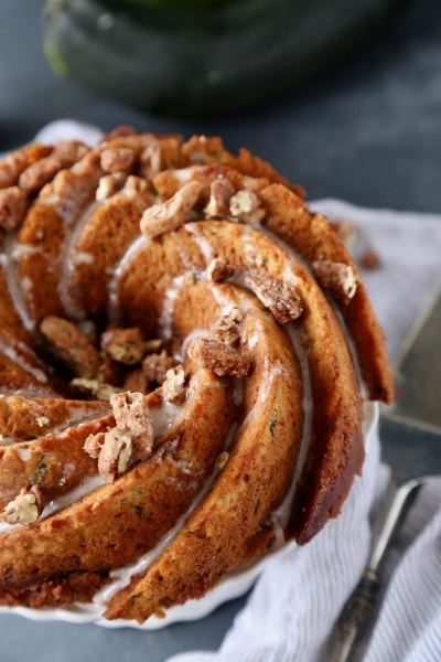 Zucchini Crumb Bundt Cake resting on a plate.