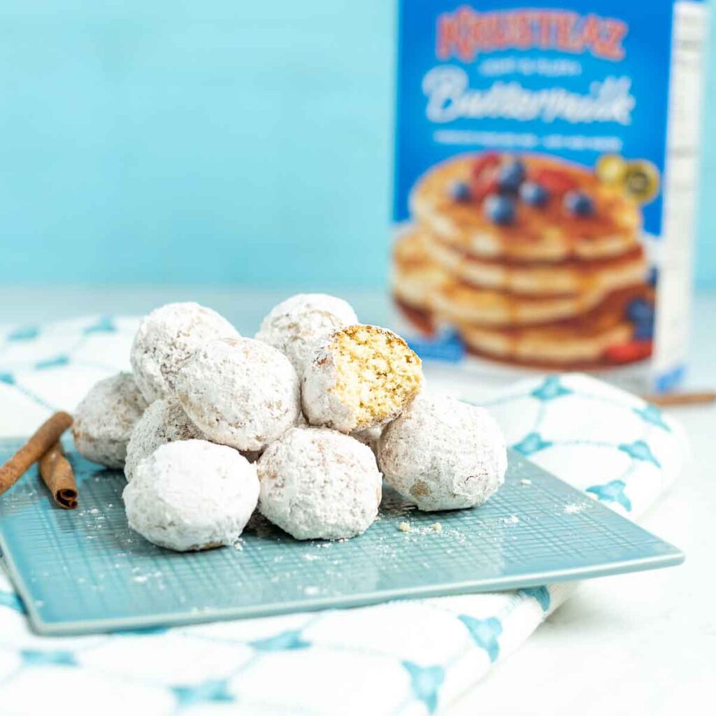 Donut holes made with Krusteaz mix, lightly dusted with powdered sugar.