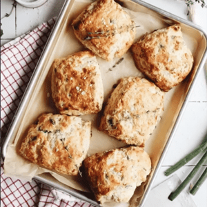 A baking sheet of Scallion, Thyme and Cheddar Biscuits.