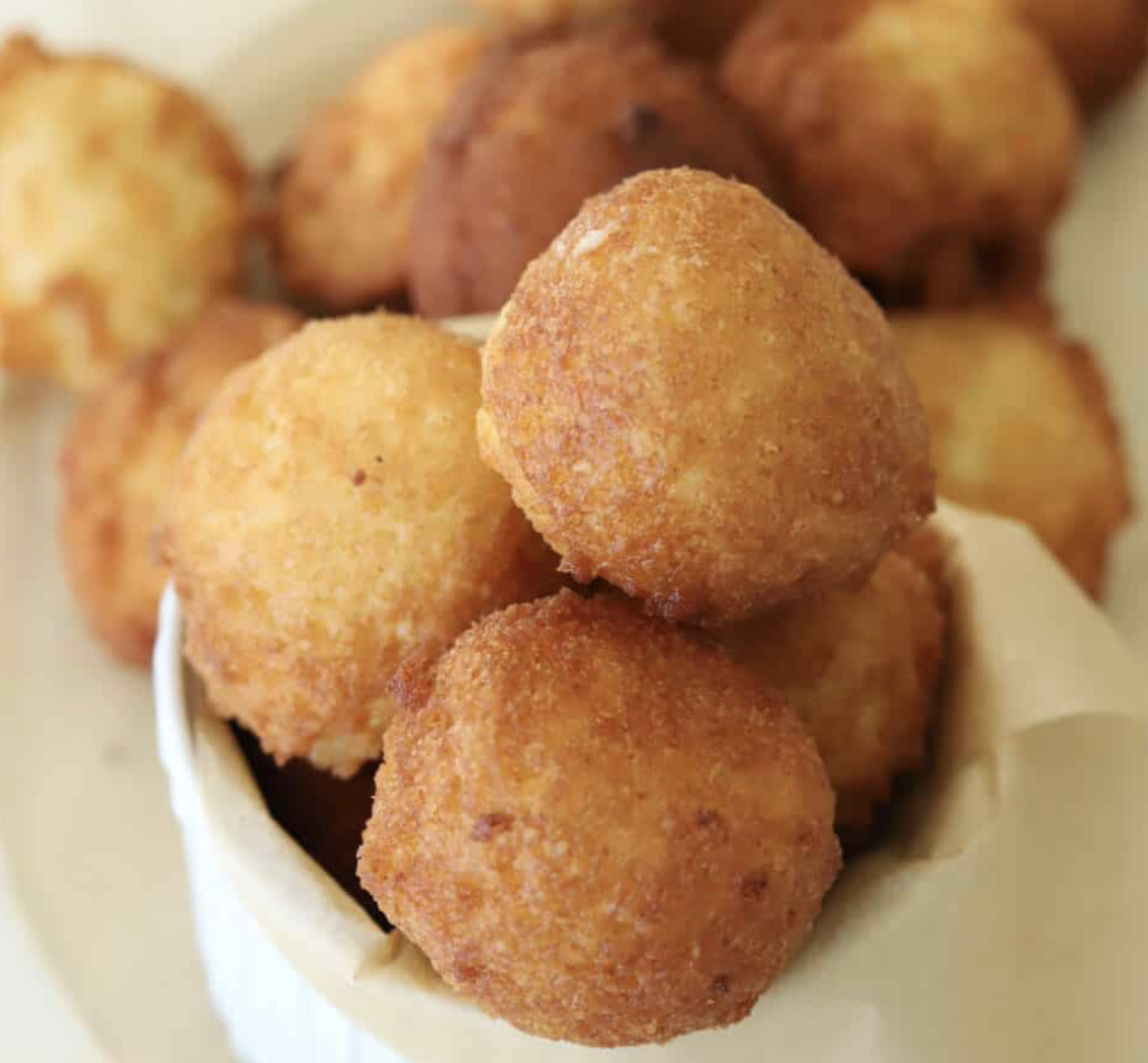 A stack of Zeppole Italian Donuts.