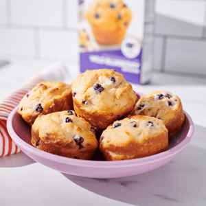 A bowl of Yogurt and Oat Blueberry Muffins.