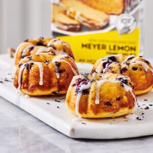 Four Mini Lemon Bundt Cakes on a platter.