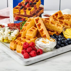 Waffle Charcuterie Board paired with fresh fruit, cheese and dips.