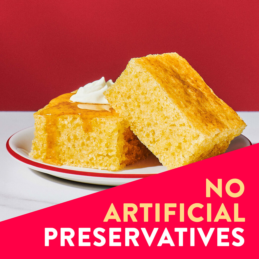 Two pieces of cornbread with no artificial preservatives overlaid on them