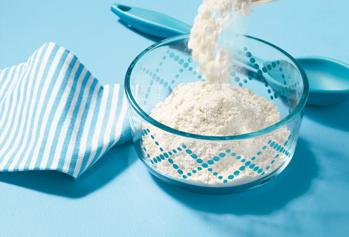Flour being poured into a bowl
